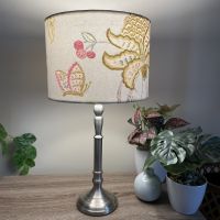 Pink floral and butterflies fabric on a medium drum light shade